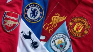 Logos of six top UK football clubs: Manchester United, Liverpool, Chelsea, Arsenal, Manchester City, and Tottenham Hotspur.